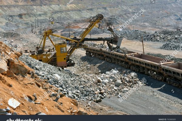 stock-photo-loading-of-iron-ore-on-the-train-in-career-76088089